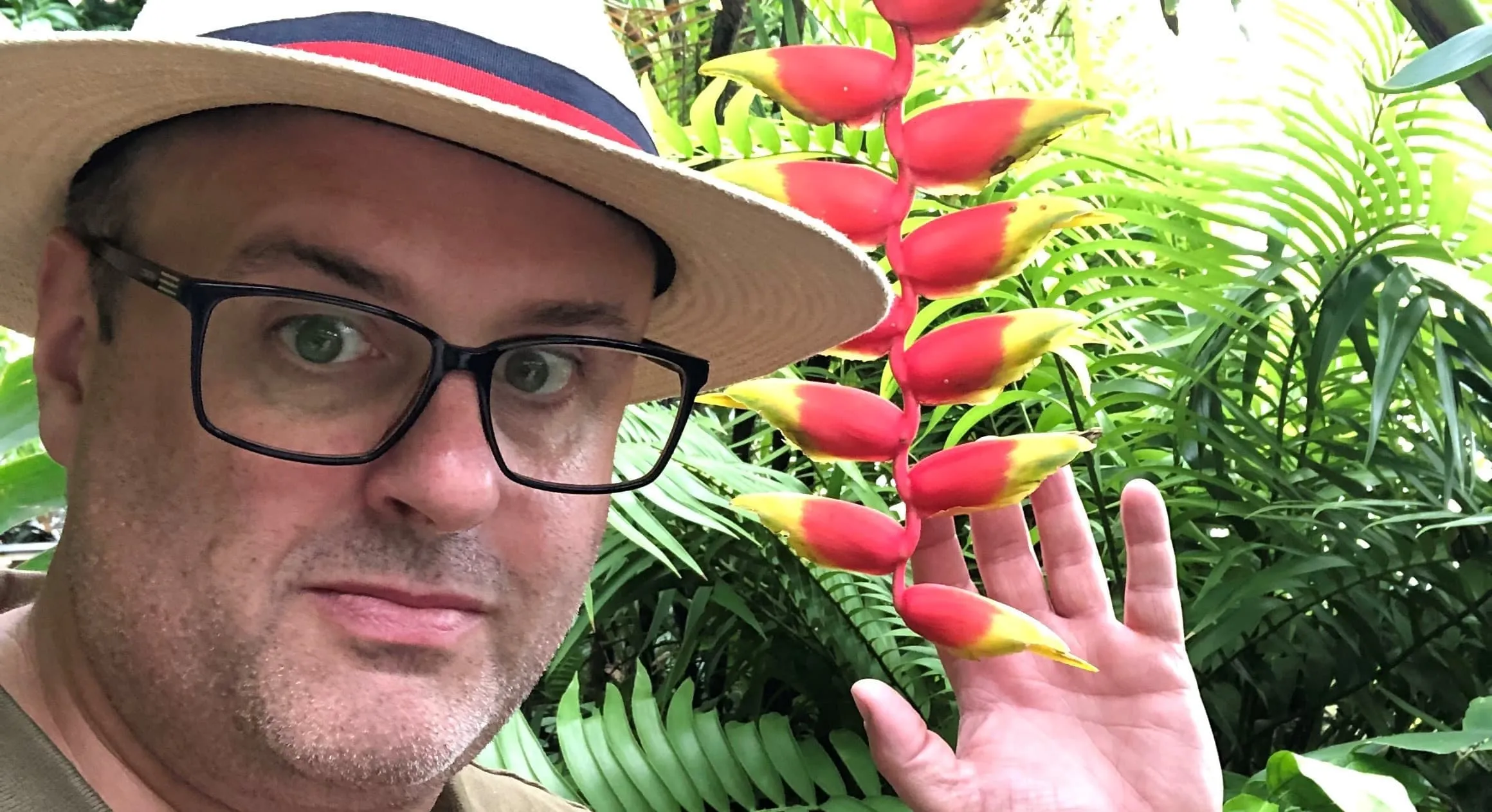 Dan posed with a plant.